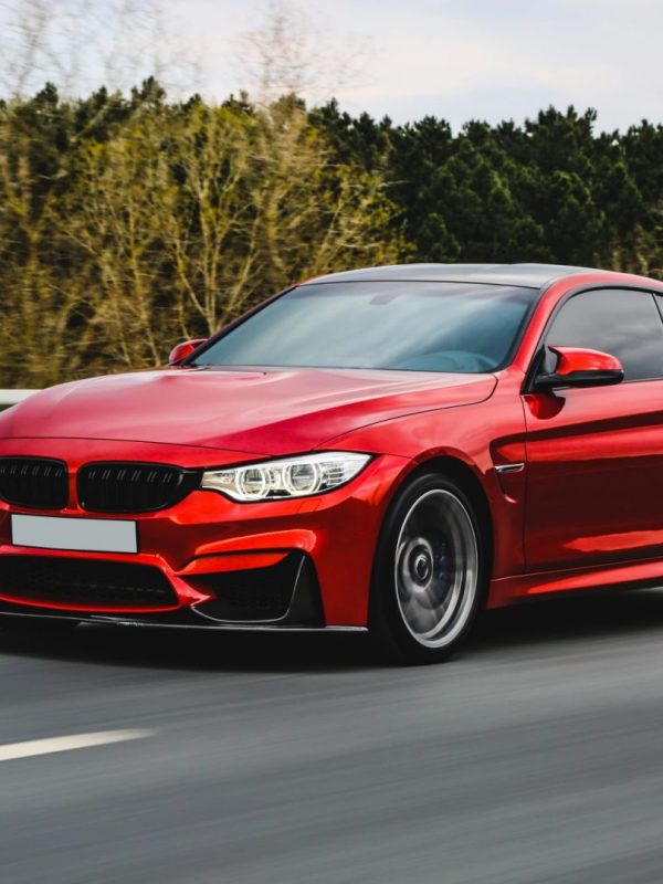 red-luxury-sedan-on-the-road